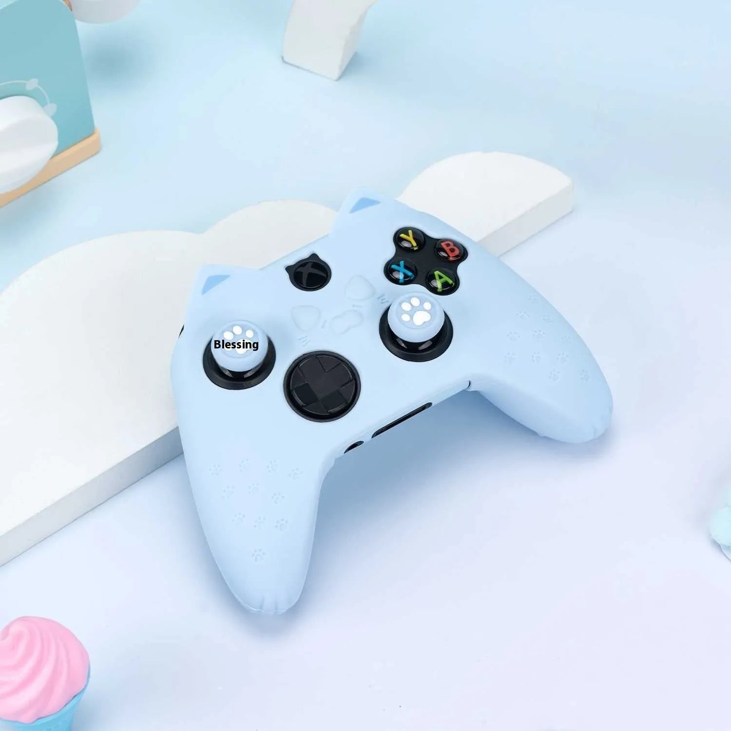 Cat ear silicone game controller cover in Pink with joystick caps and sticker on a white background