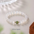 Handmade white agate and hetian jade bracelet with red cinnabar inlay forming text, shown in 6mm and 8mm bead sizes.