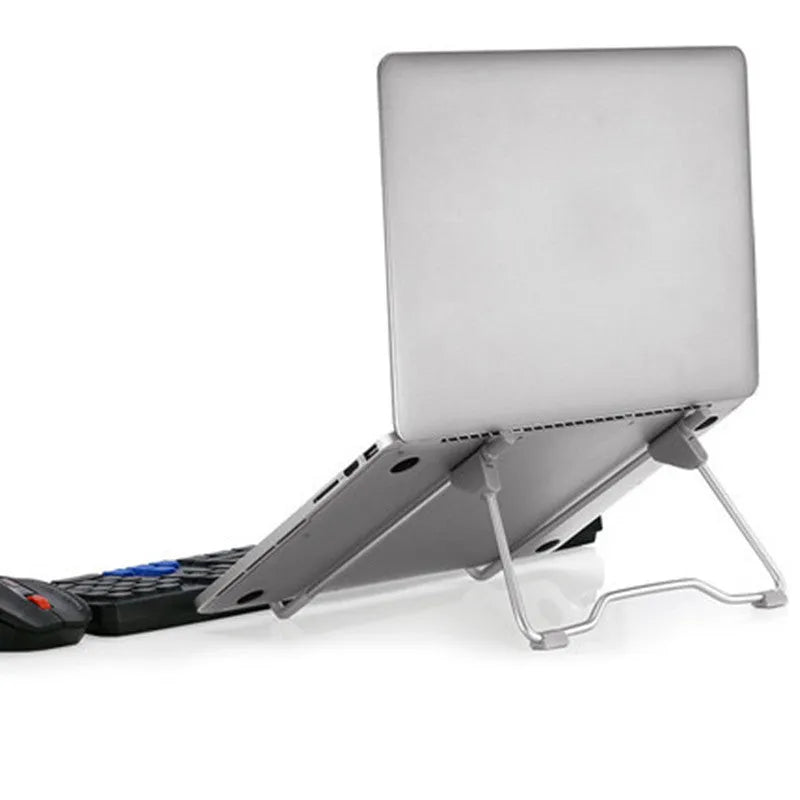 Grey aluminium alloy and plastic mobile phone and laptop stand on a wooden desk.