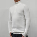 Man wearing a grey half turtleneck zipper sweater, a British style cotton blend pullover for spring.