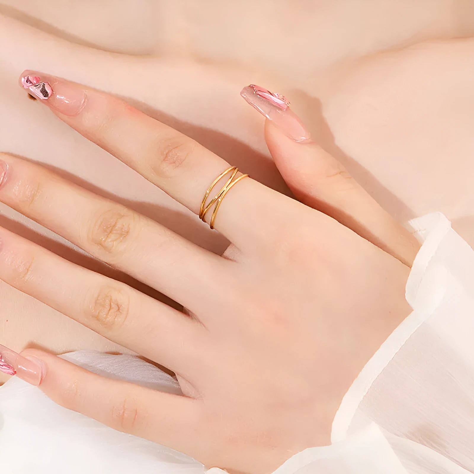 Gold-coloured geometric line ring with three-layer coil design on titanium steel band