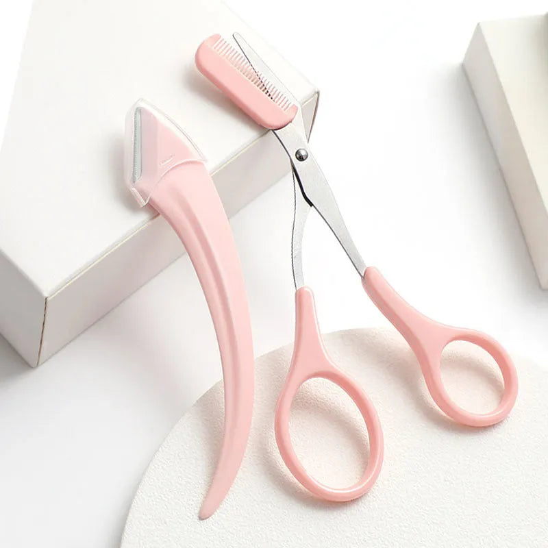 White and pink eyebrow trimmer with stainless steel blade and curved plastic comb