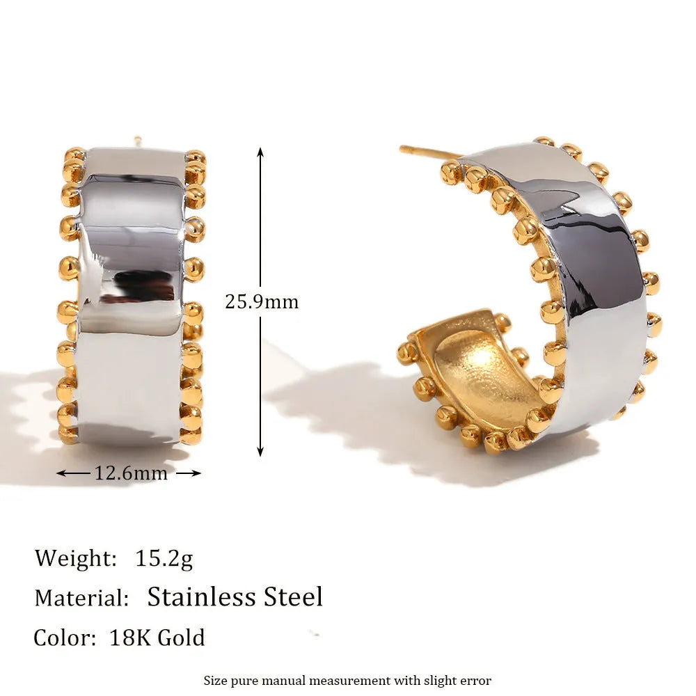 Gold geometric stainless steel earrings, bracelet, and necklace set on a white background.