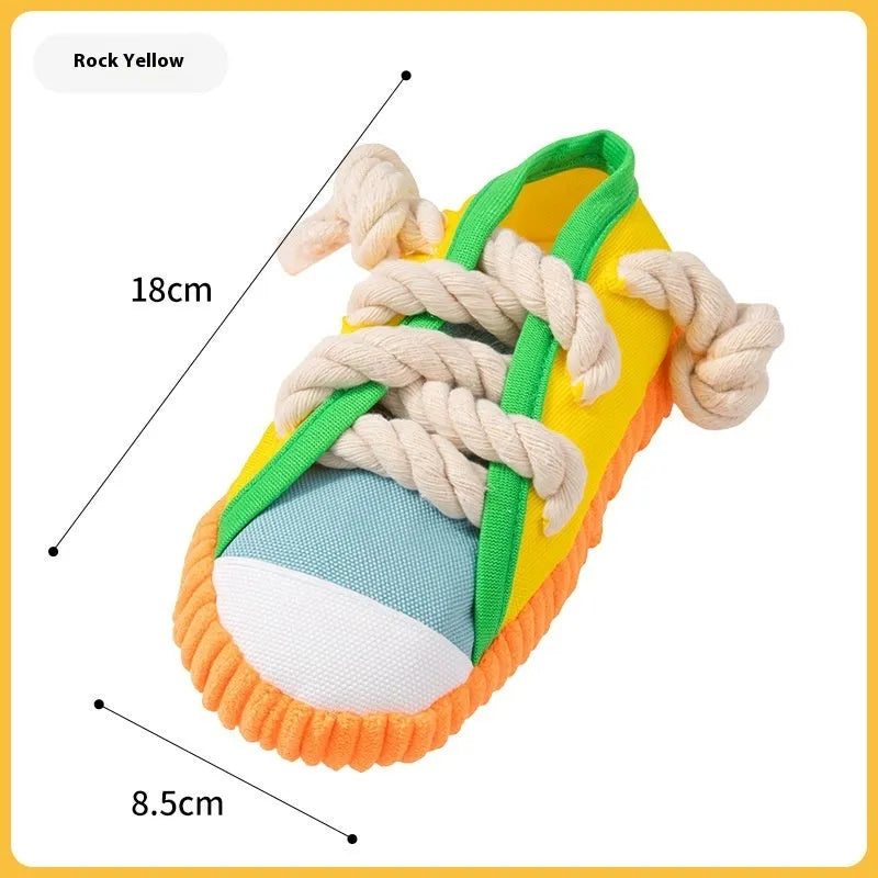 Flexible plastic dog chew toy shaped like a slipper in yellow, with a bendable design and sound chip.