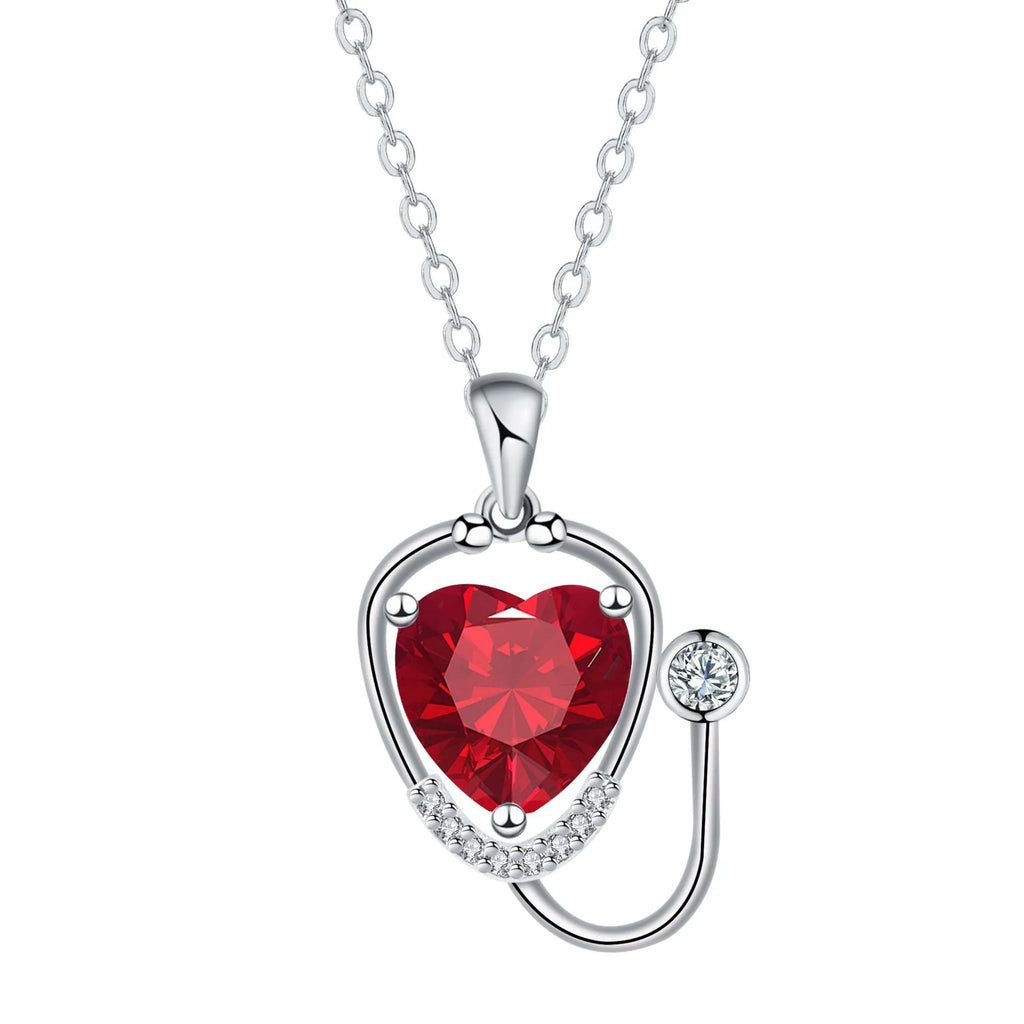 Copper women's necklace with wings cross stethoscope pendant in red diamond electroplated finish.
