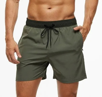Men's blue athletic shorts with a stitching waistband, drawstring, and side headband pocket.