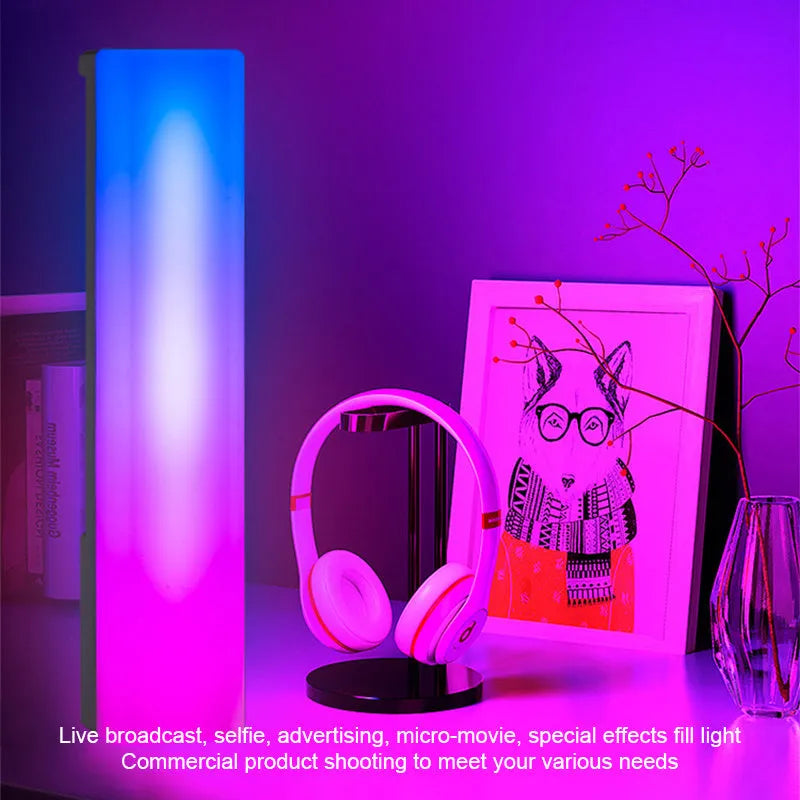 Tall 3D RGB LED ambience lamp with colourful lights on a desk, showcasing its voice-activated music rhythm mode.