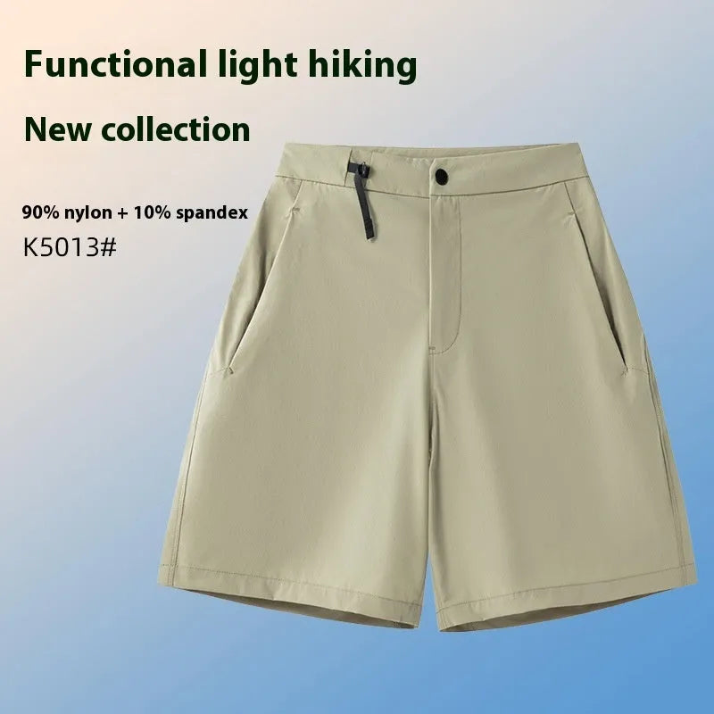 Men's solid colour quick-dry sports shorts with elastic sides on a neutral background.