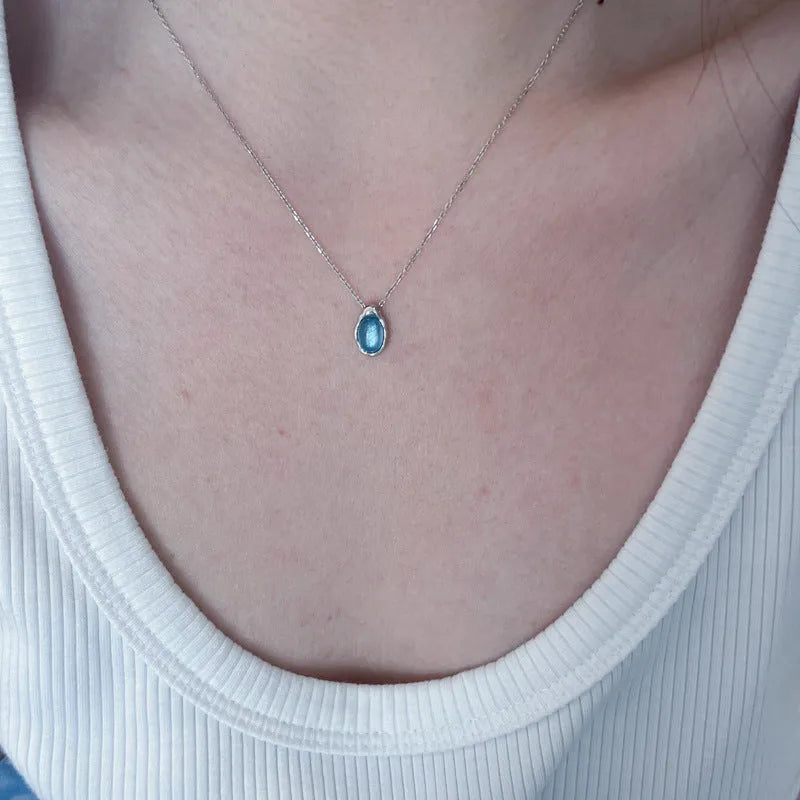 Navy blue water drop pendant necklace with geometric copper pendant on adjustable chain