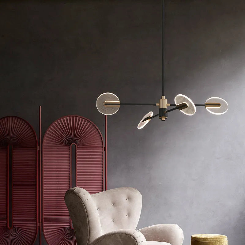 White iron frame LED chandelier with multiple acrylic shades hanging from ceiling