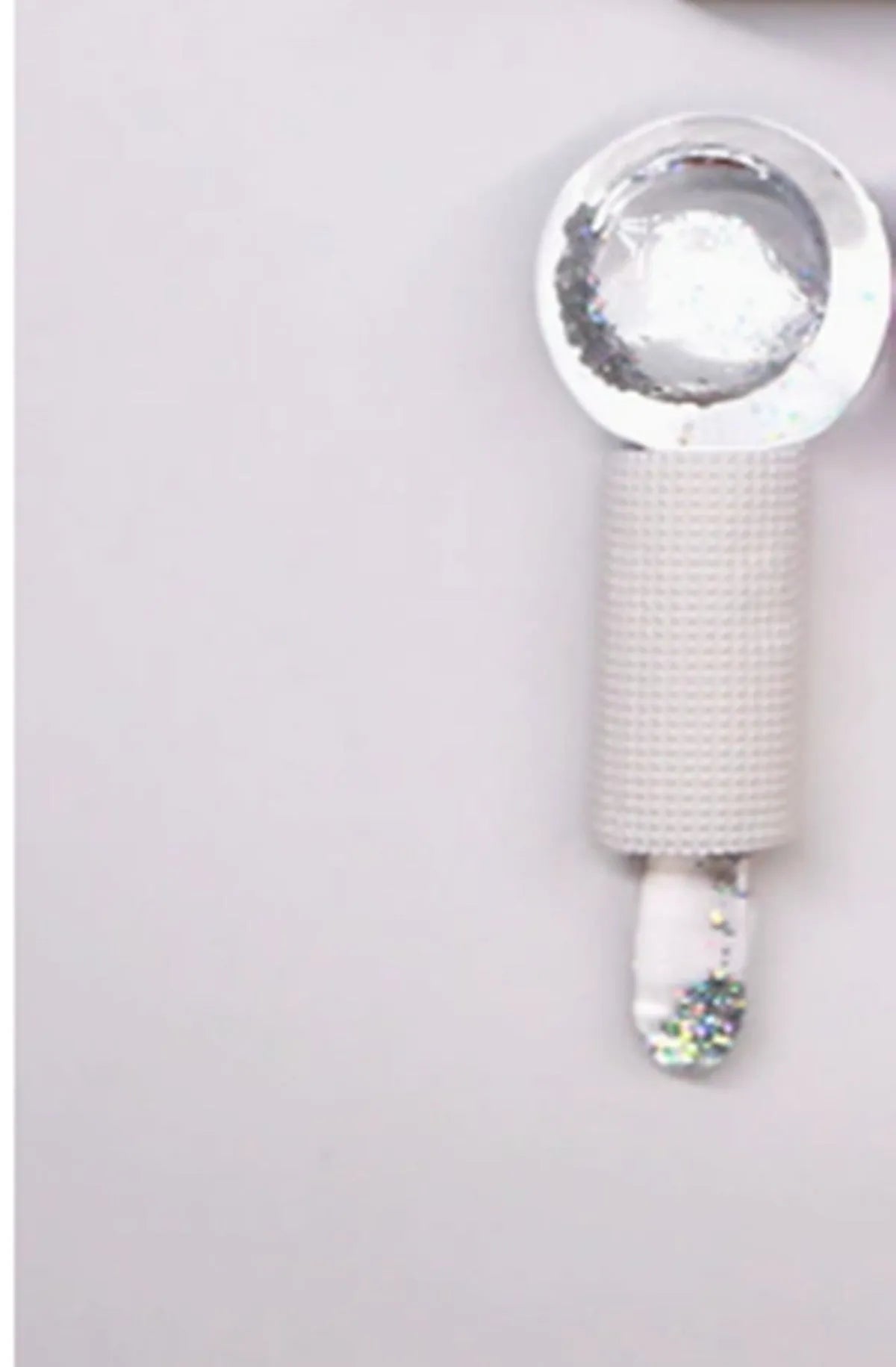 Set of two beauty ice wave ball face massage tools in purple flash finish on white background