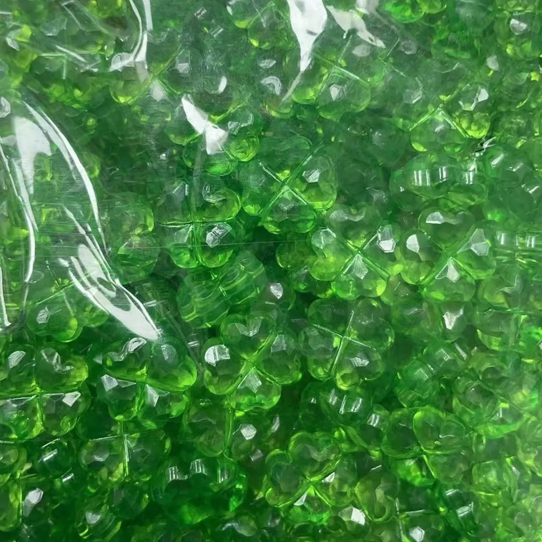 High transparency acrylic fat clover camellia beads scattered on white surface