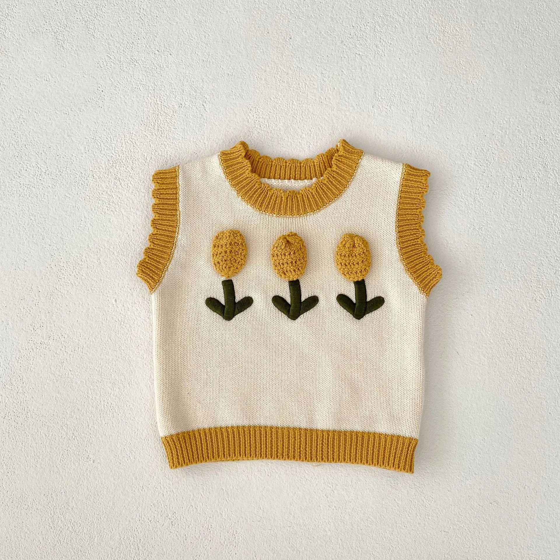 Baby girl sleeveless knitted cotton top with three-dimensional flower in almond white