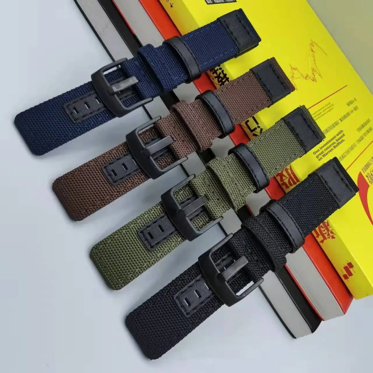 Oxford cloth canvas watch replacement strap shown in multiple colours including army green and camouflage.