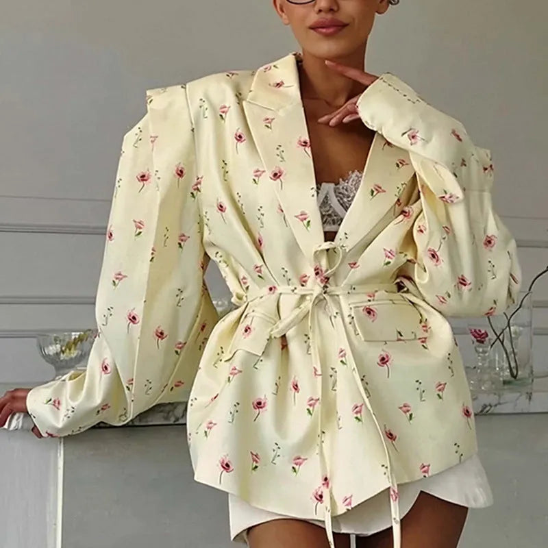 Women's white suit jacket with lace-up detail at collar and waist, long sleeves, regular fit