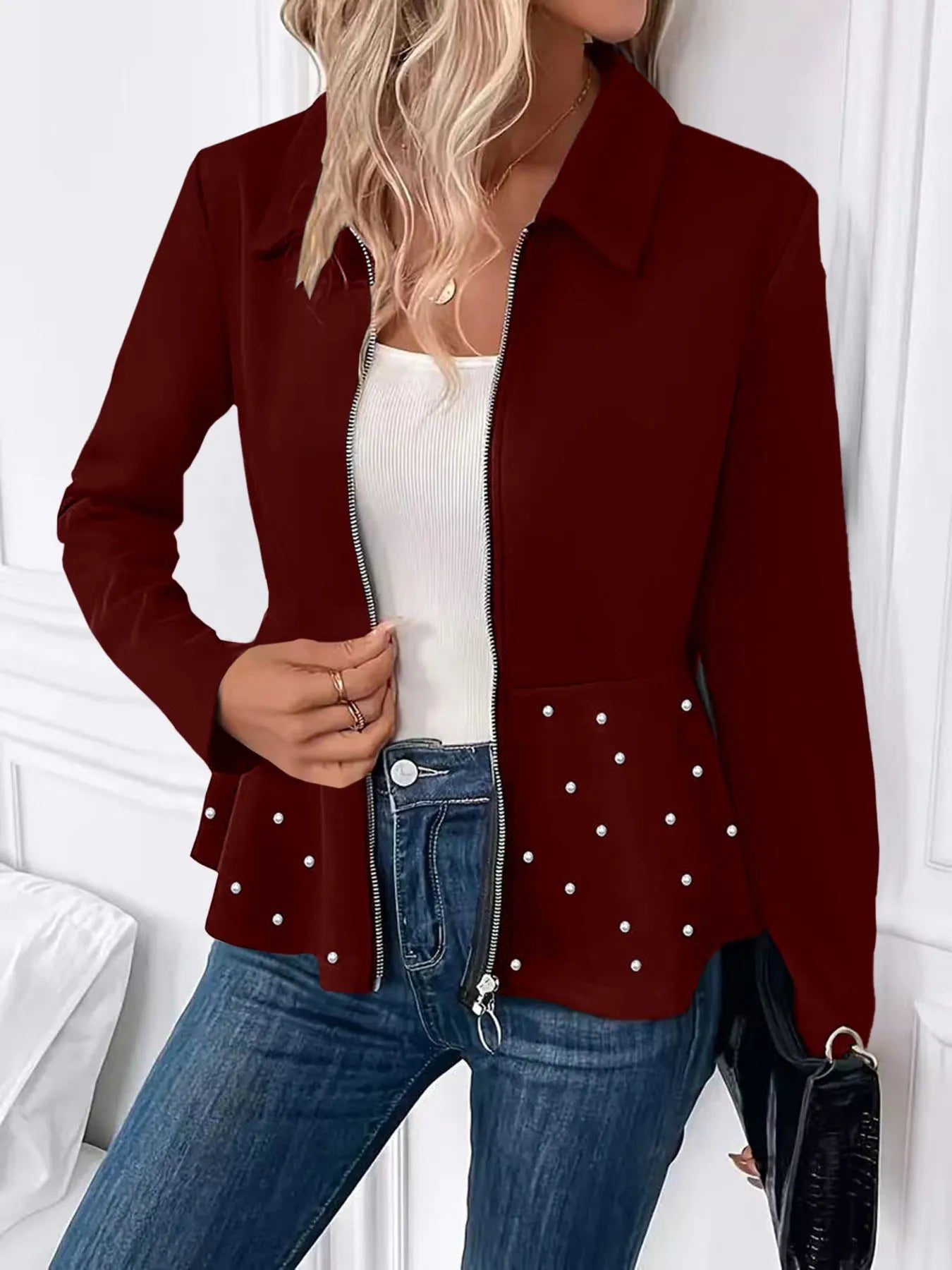 Women's black coat with heavy-duty zipper and ruffled hem in loose fit design