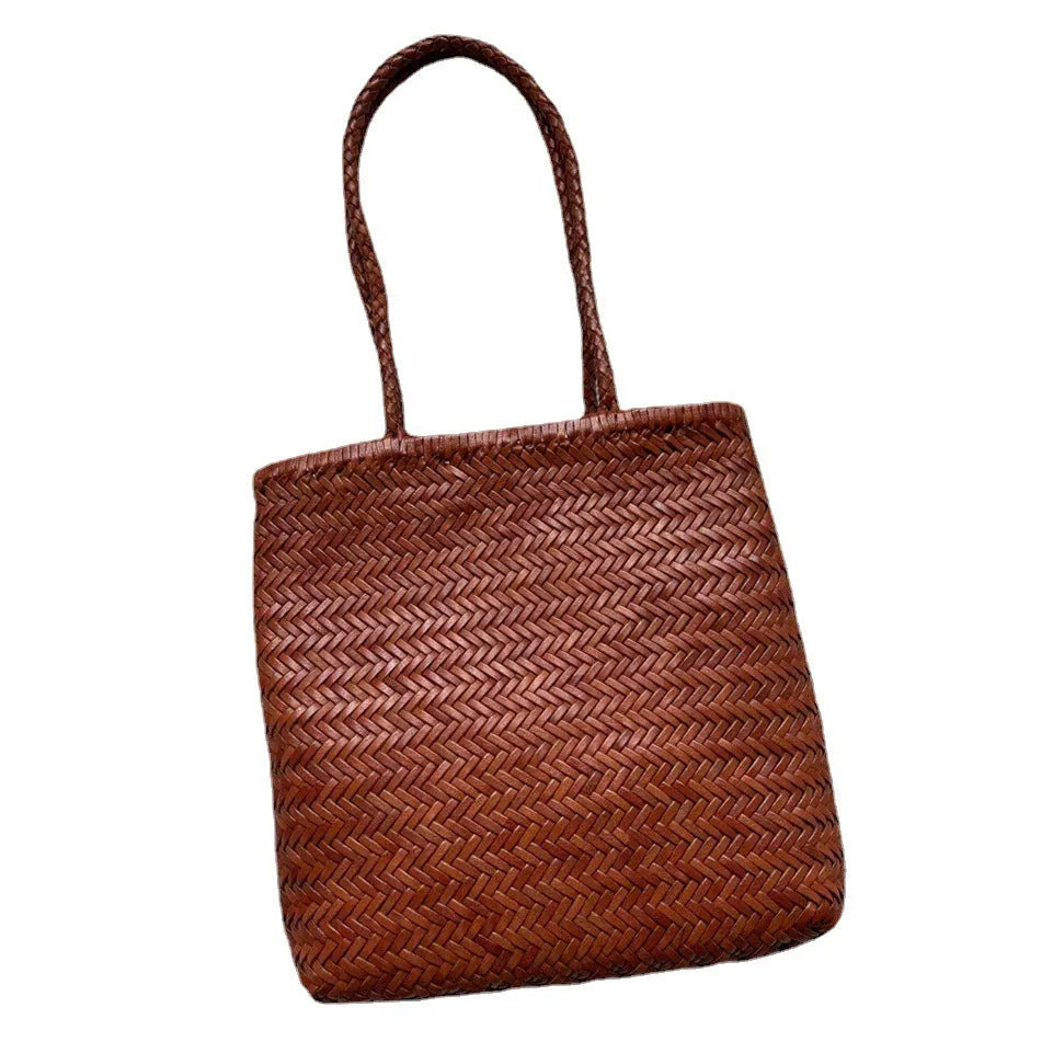 Brown woven tote shoulder bag with three-dimensional pocket made from first layer cowhide leather