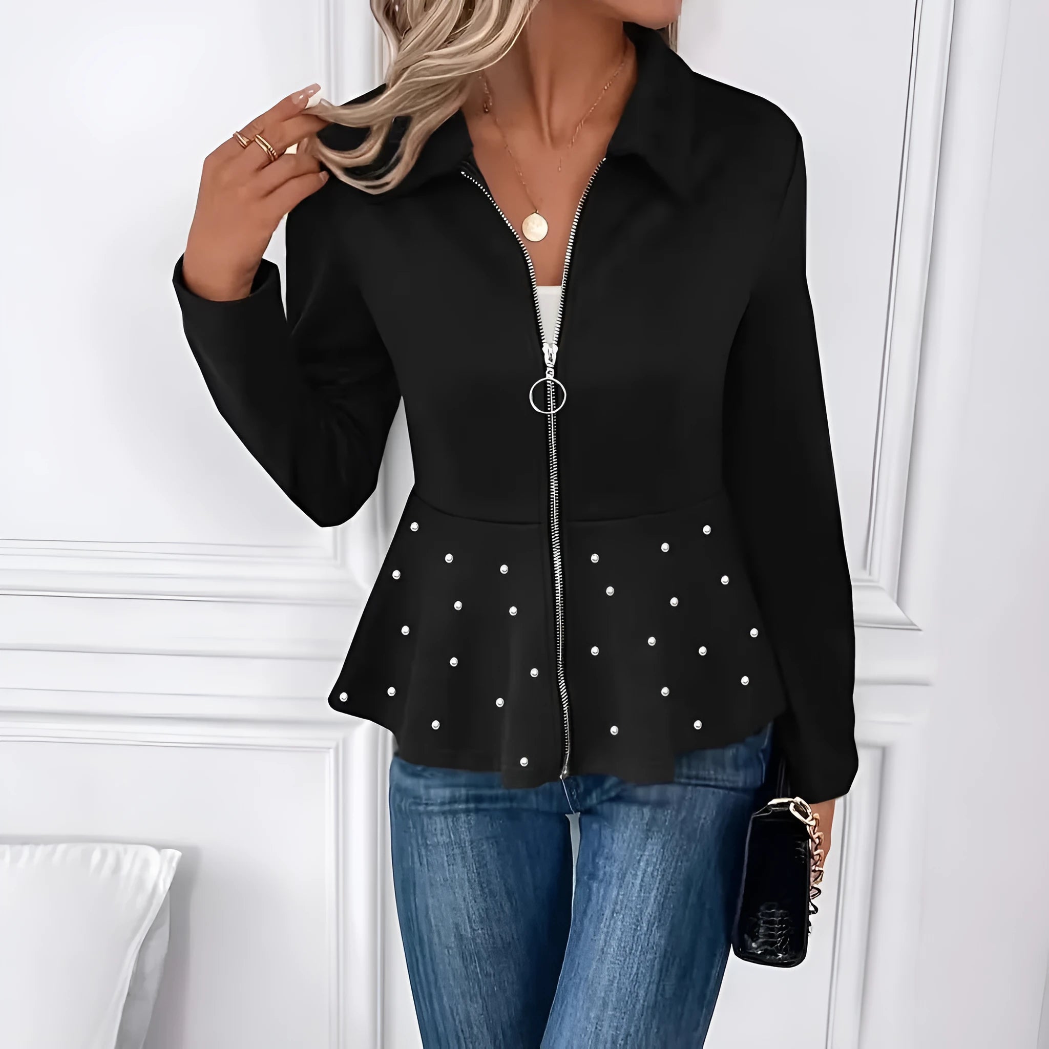 Women's black coat with heavy-duty zipper and ruffled hem in loose fit design