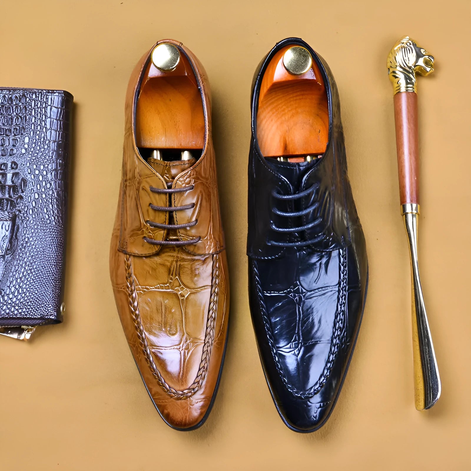 Men's black leather business shoes with alligator pattern styling and horse bit buckle detail
