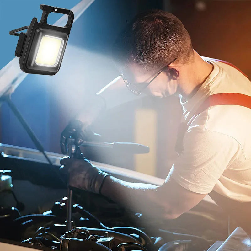 Black aluminium alloy USB rechargeable keychain torch with magnetic base and foldable handle