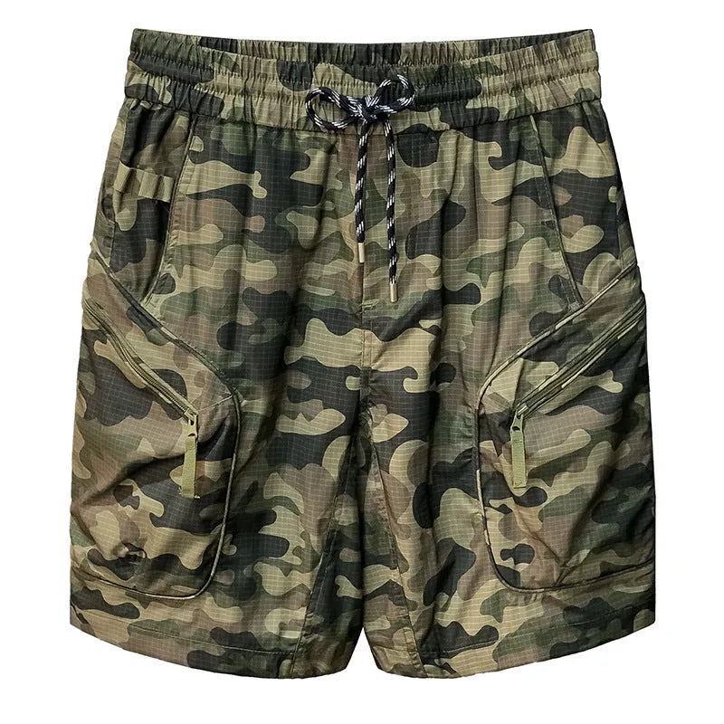 Man wearing loose-fit camouflage cargo shorts with multiple pockets, made from a cotton blend fabric.