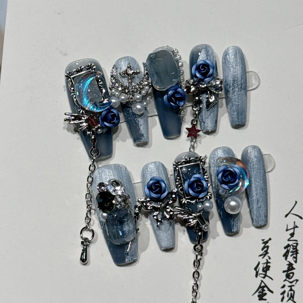 Heavy industry blue false nails with ornate rose and tulip pattern, shown in sizes XS S M L.