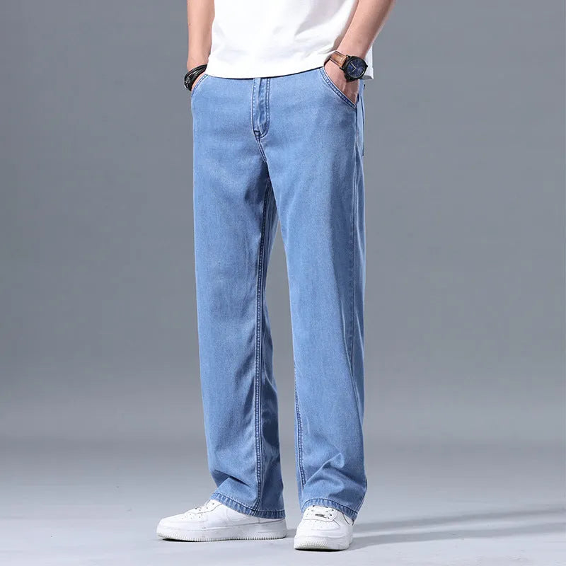 Men's loose straight-leg lyocell jeans in light blue, blue grey, smoky grey, and retro blue colours with zipper fly