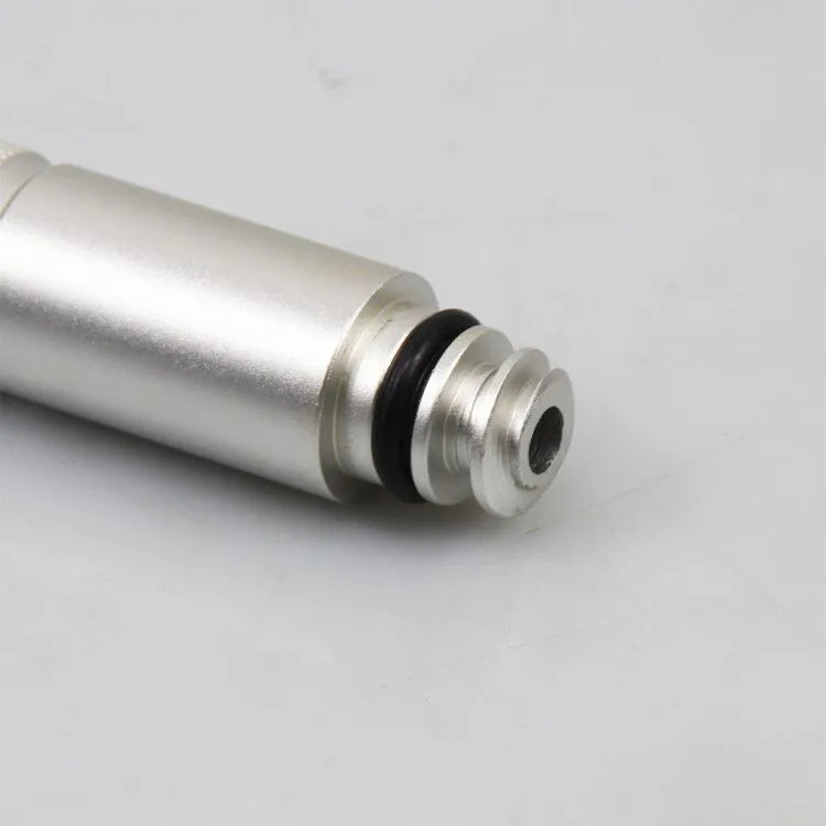 Silver metal transmission refuelling joint for VAS6262-9 tool on a workshop bench.