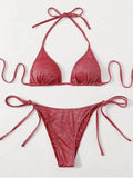 Women's bandage-style bikini swimsuit in black, shown as a two-piece set.
