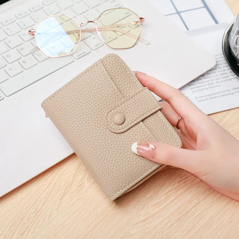 Ladies short wallet with lychee pattern texture in PU leather showing 2-fold design