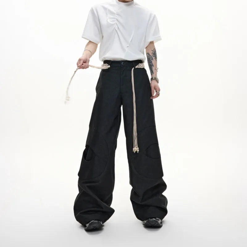 Men's dark wash straight-leg jeans with 3D cutting, zip decorations, and tassel details