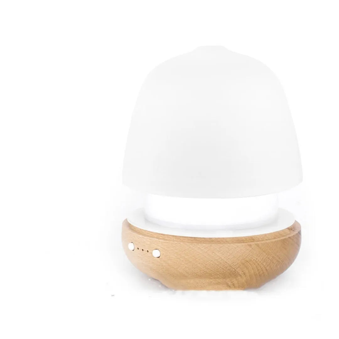 White ceramic ultrasonic essential oil humidifier with 180ml capacity on a table top