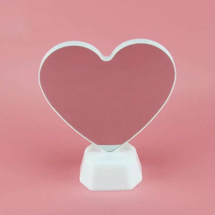 Rose red LED double-sided love tunnel light on a tabletop showing its plastic construction and dimensions.