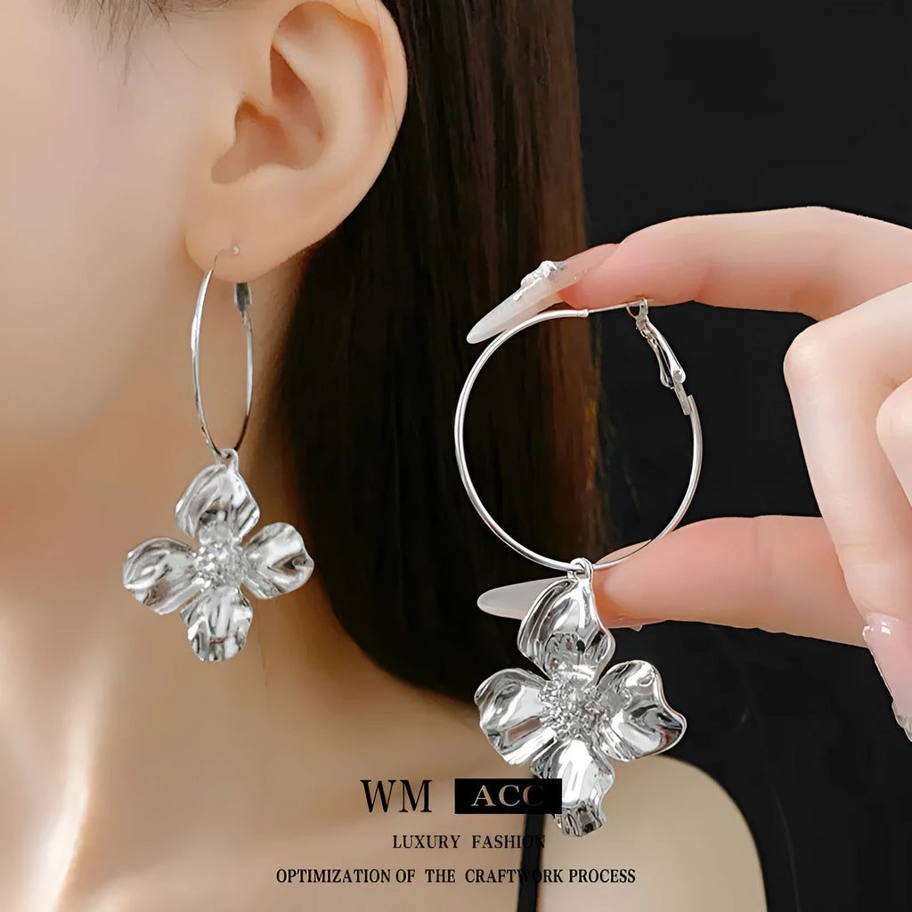 Silver needle metal flower earrings with geometric design in gold and silver electroplated finish