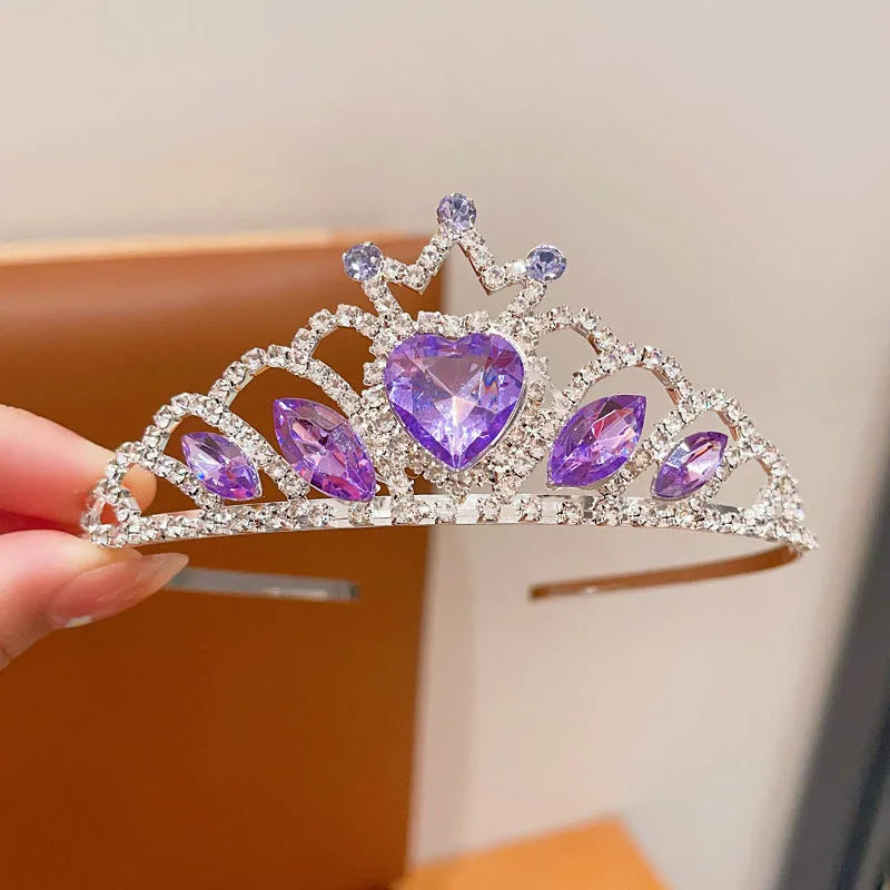Children's electroplated alloy metal headband with crown shape and crystal decoration in pink, blue, or purple.