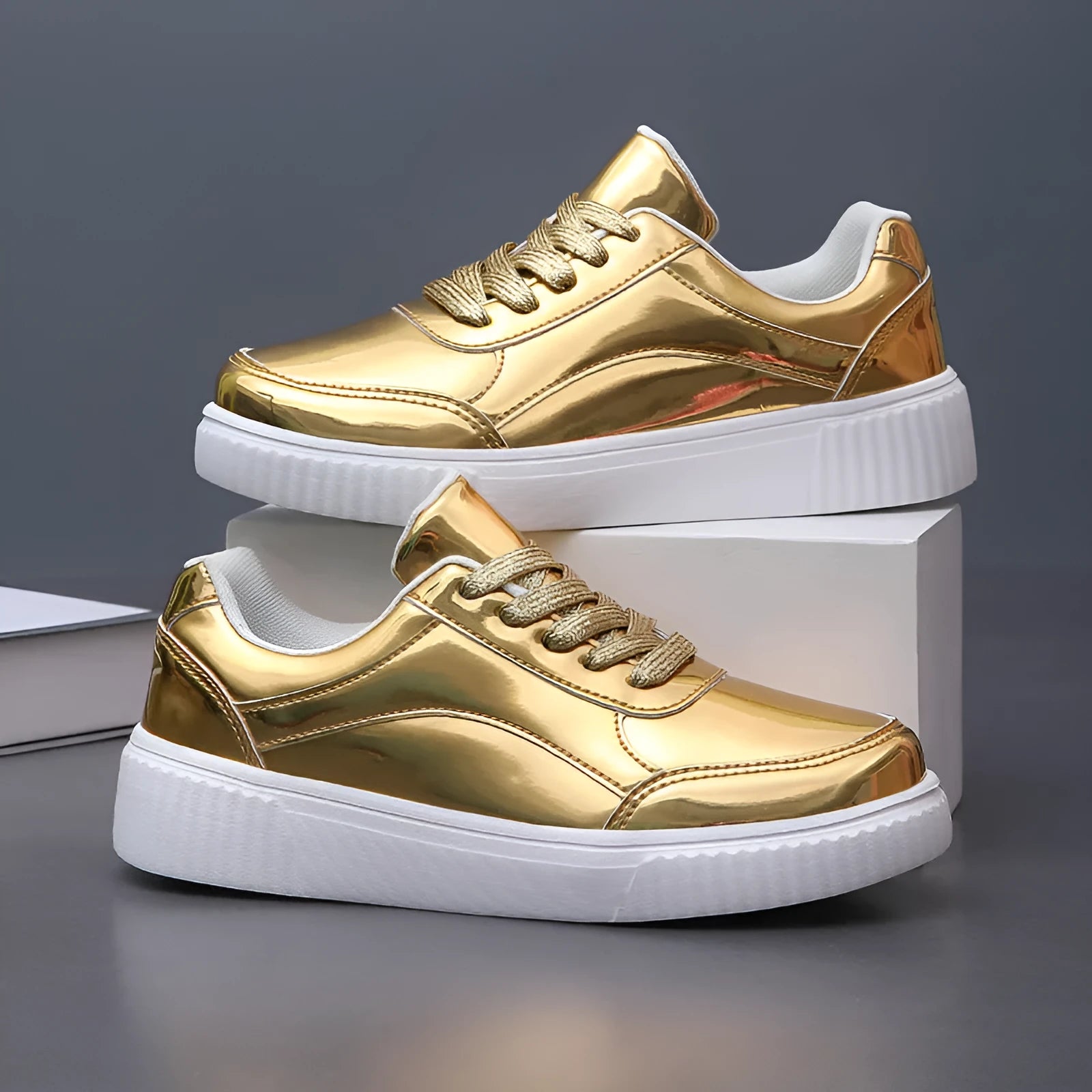 Gold sequinned platform sneakers with a round toe and a thick MD sole.
