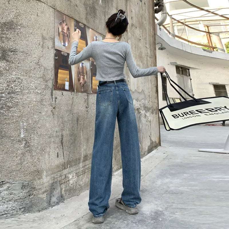 Women's retro blue high-waist straight-leg jeans on a neutral background.