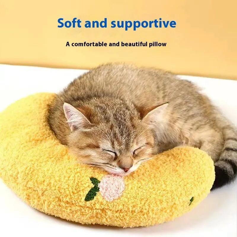 Blue U-shaped pet pillow for cat neck support with moon design on cloth material