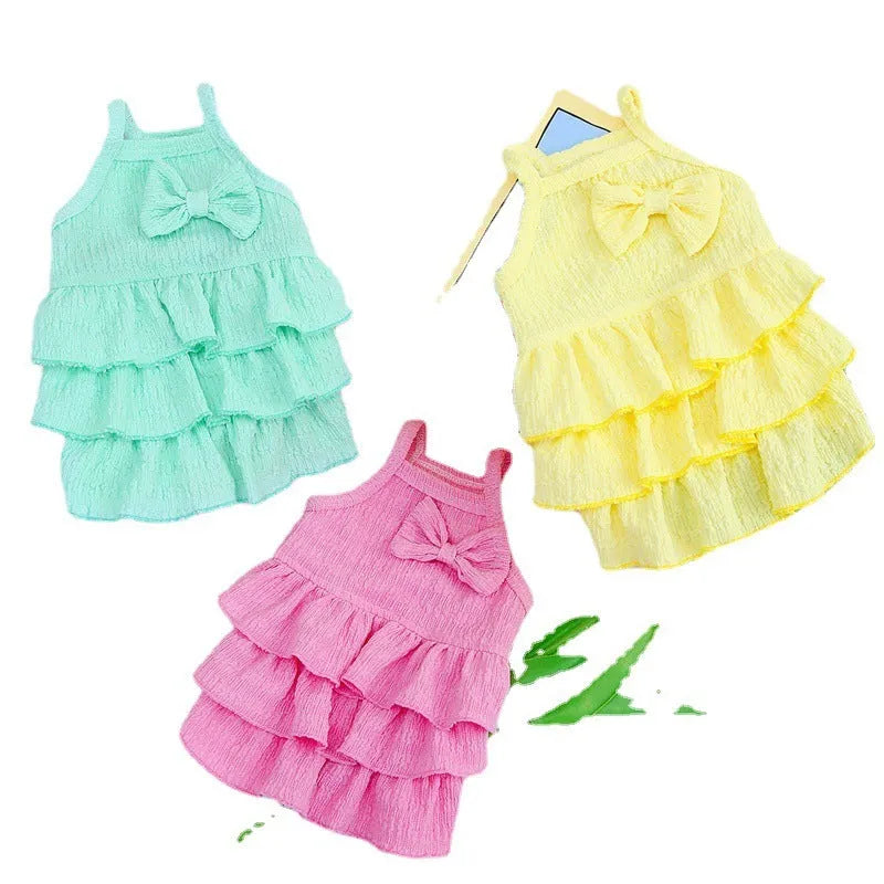 Small dog wearing rose red princess dress with layered skirt candy theme
