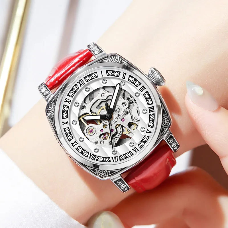 Mechanical wristwatch with luminous hands on a leather strap, shown in multiple colour options.