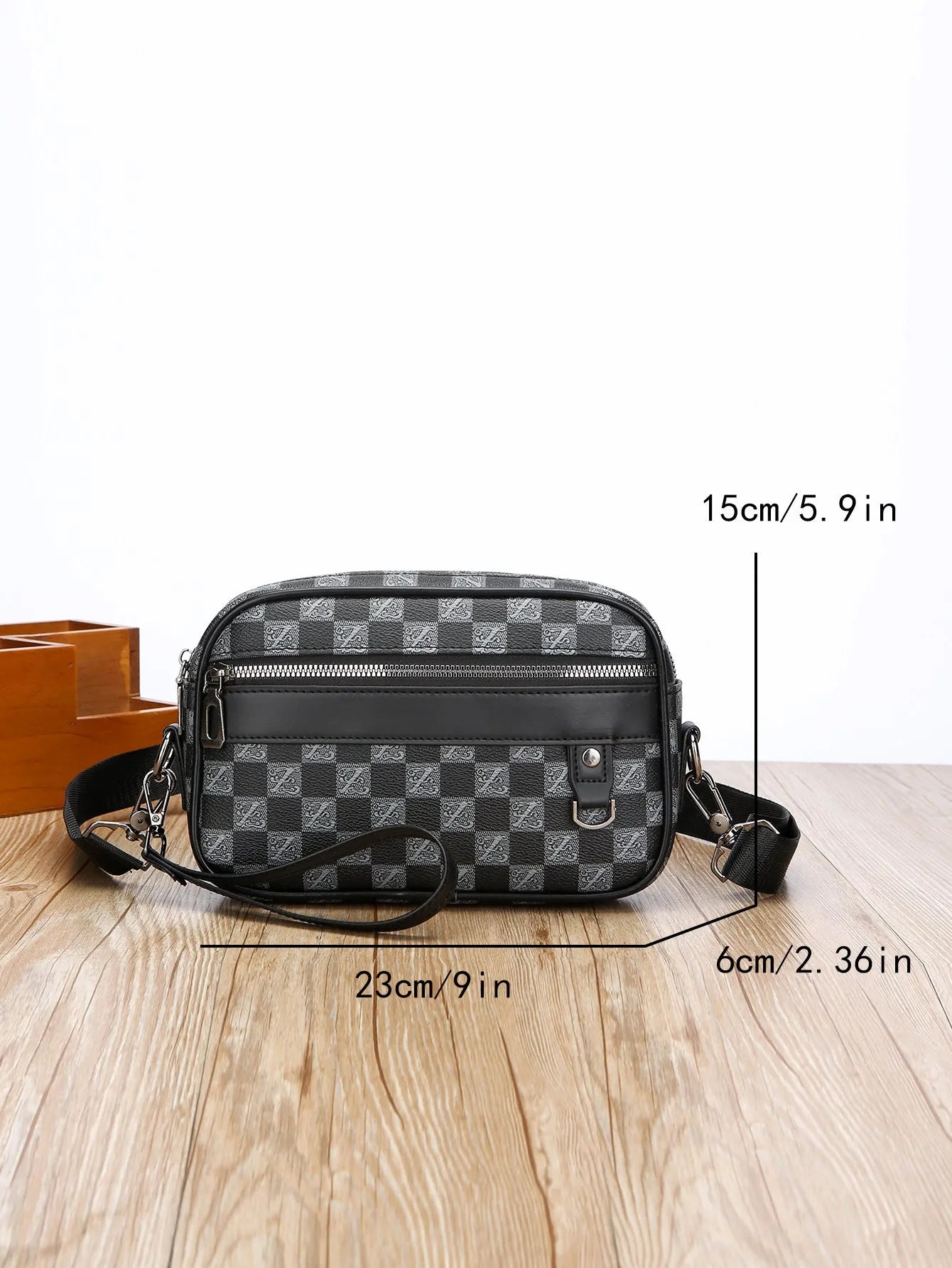 Men's black geometric pattern PU messenger bag with a shoulder strap, shown horizontally.