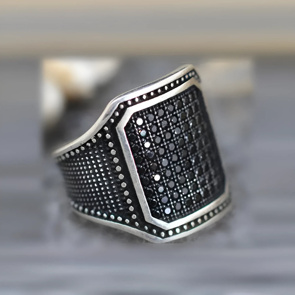 Black alloy ring with copper inlay around zircon stone, unisex design available sizes 7 to 13