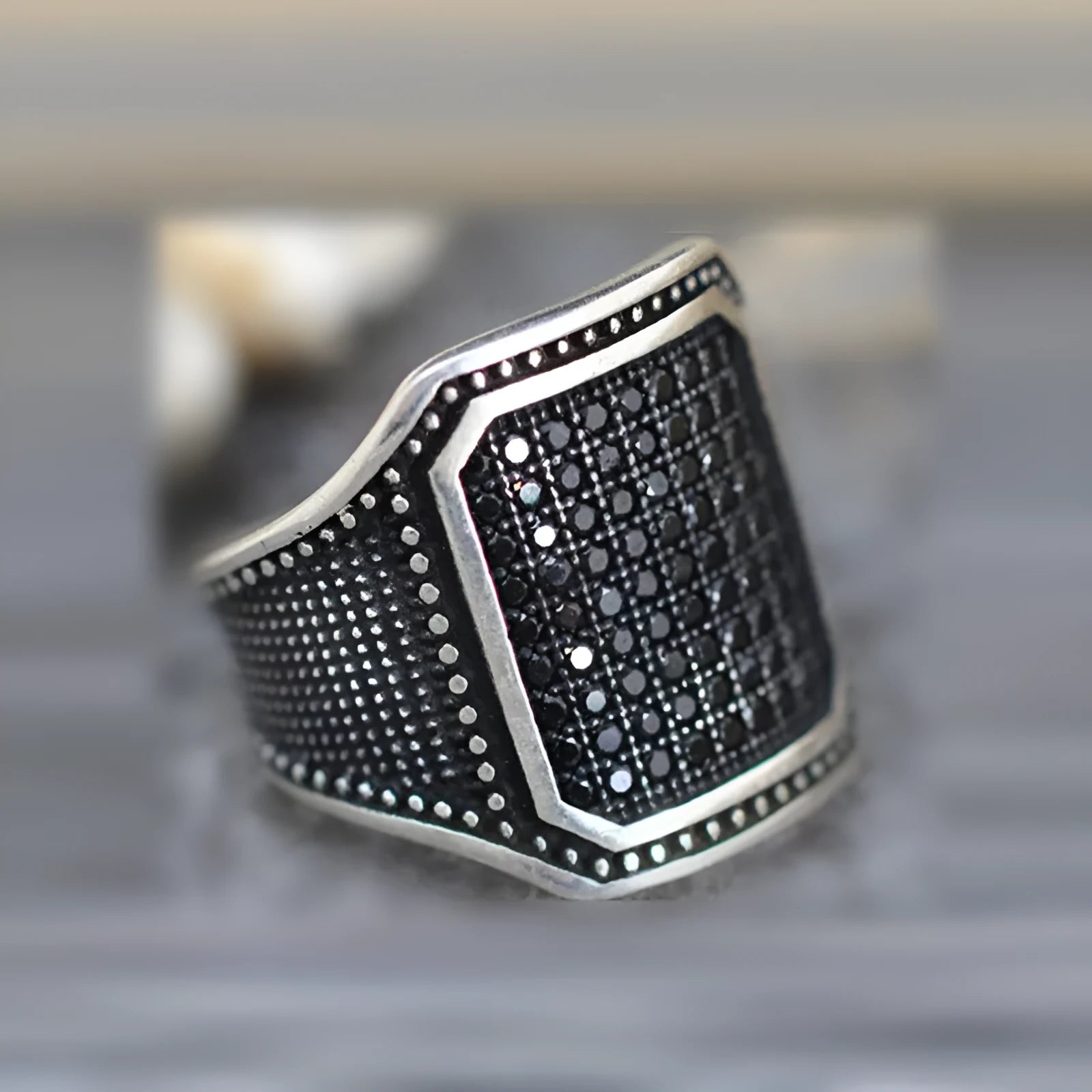 Black alloy ring with copper inlay around zircon stone, unisex design available sizes 7 to 13