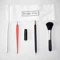 Scratch painting tool set with healing pens, brushes, scrapers, and photo frames on white card paper