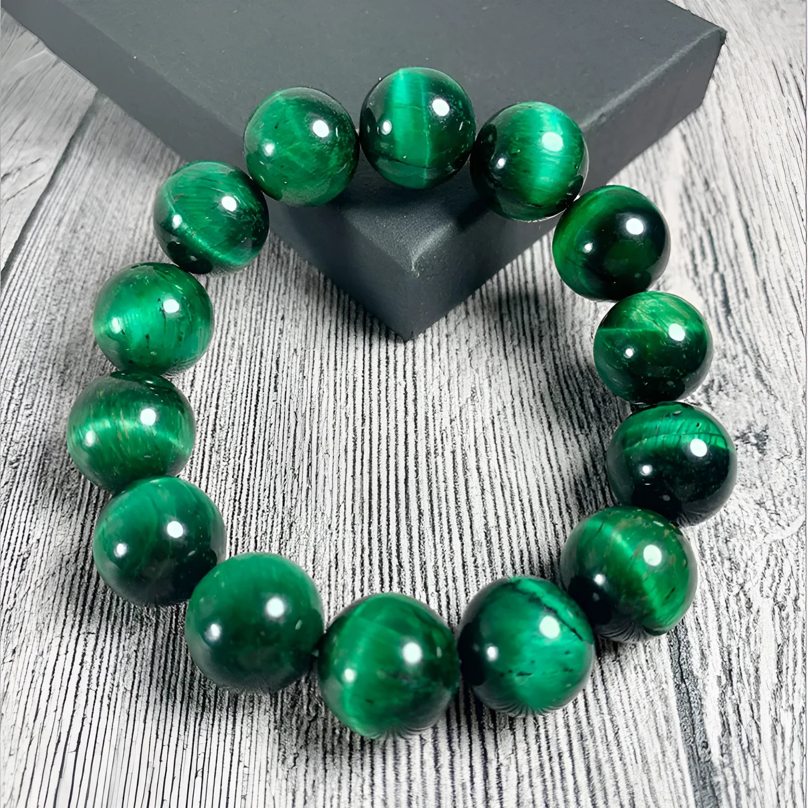 Green Natural Tiger Eye stone bracelet with geometric beads on a wrist.