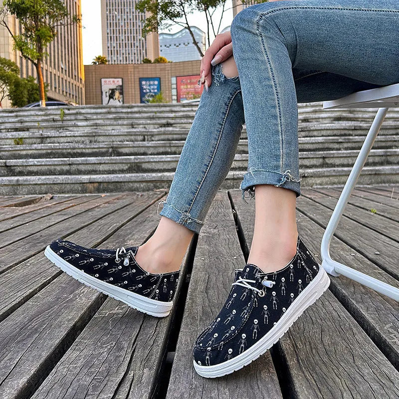 Women's black canvas low top casual shoes with soft sole, cloth lining, available in sizes 37 to 42