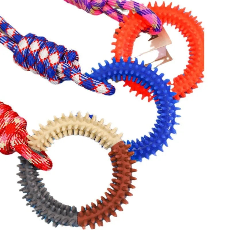 Colourful blue braided rope dog toy with multiple knots, shown on a plain background.