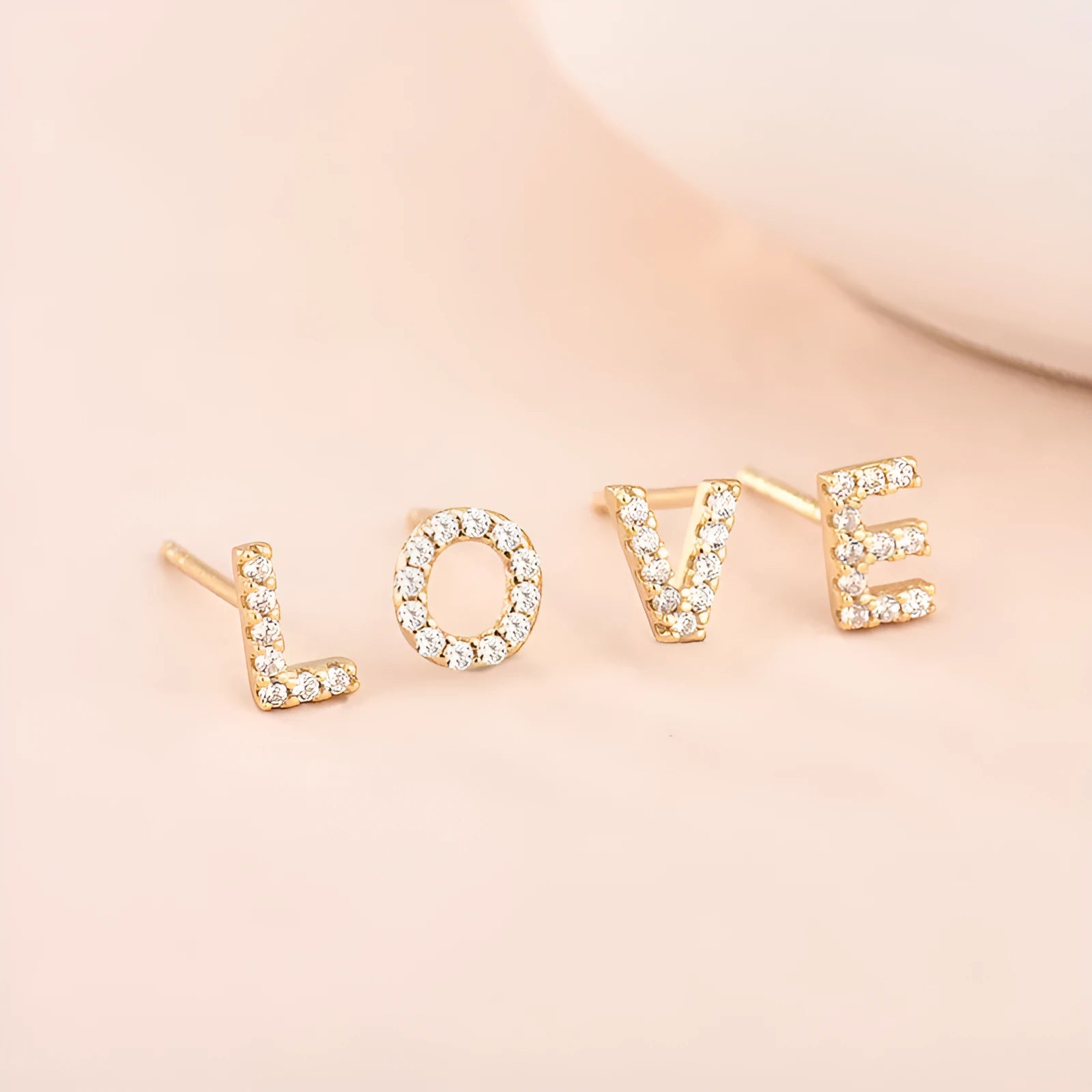 Brass gold plated alphabet letter earrings showing zircon detailing on copper base with 26 English letters available