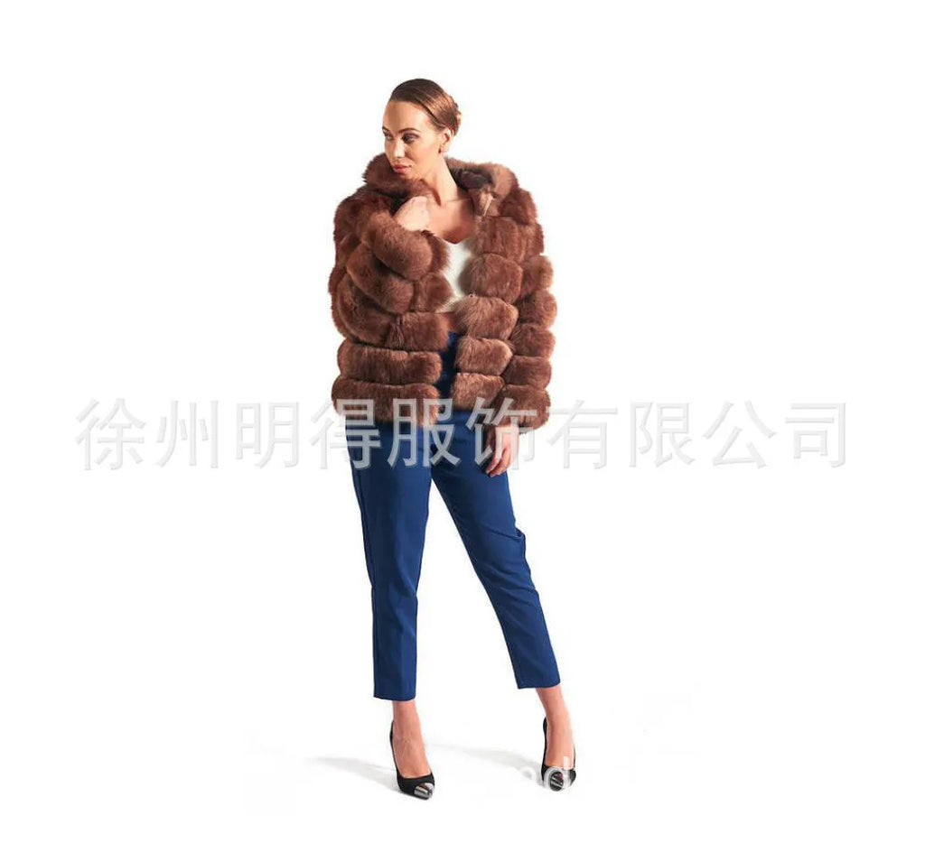 Loose-fitting hooded women's coat in artificial fur, shown in brown and white silver fox colours.