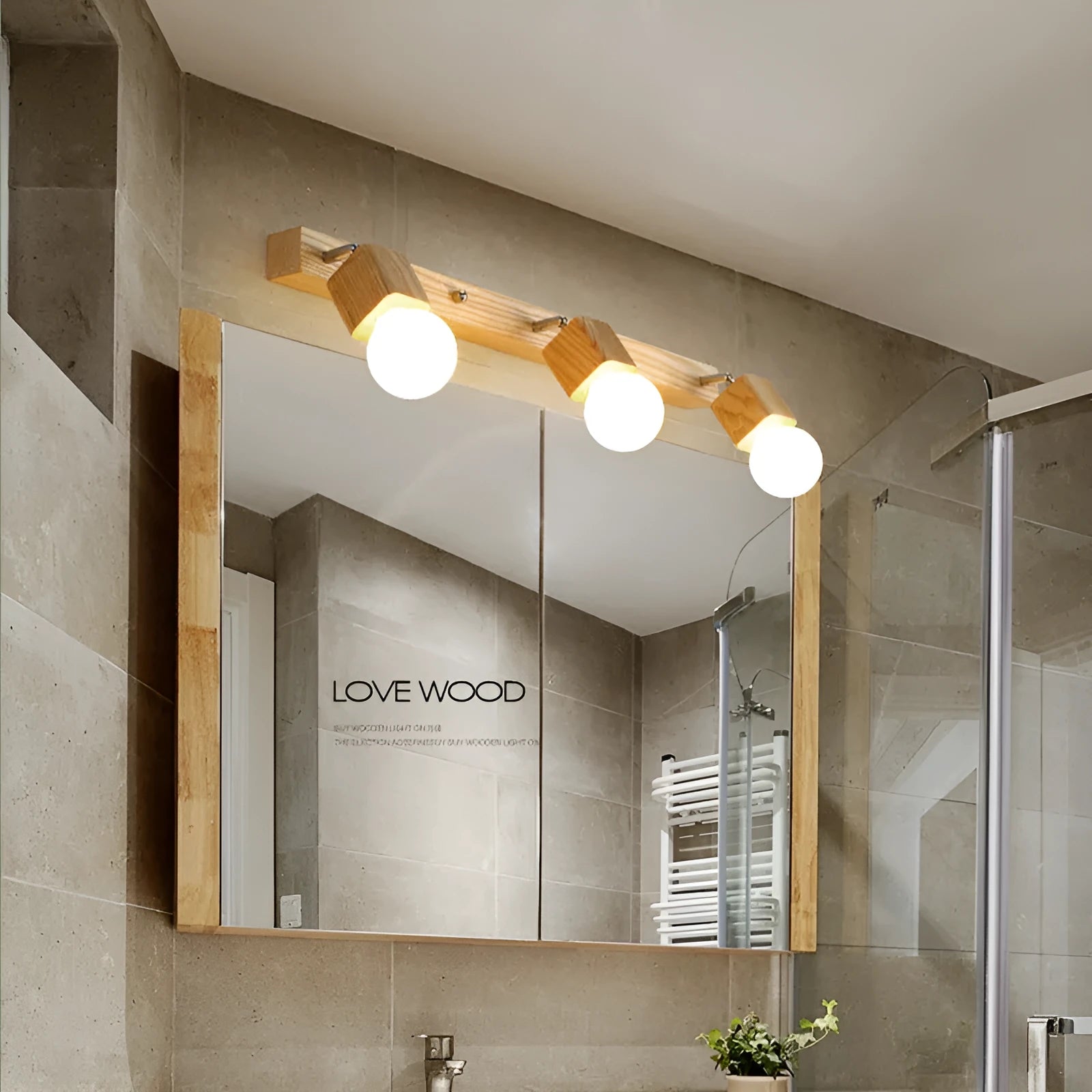 24cm round mirror finish LED wall lamp with a single light head for vanity lighting.